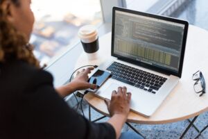 A woman programmer working on the computer.